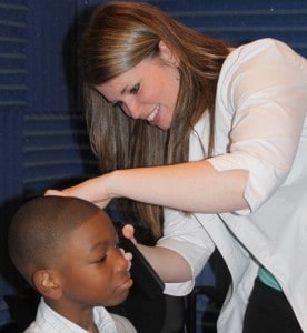 Doctor examining pediatric patient