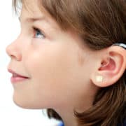 child with hearing aid