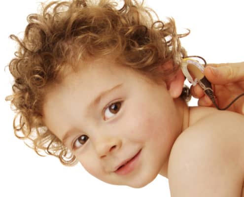 Toddler with hearing aid