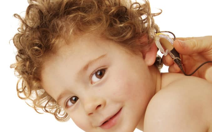 Toddler with hearing aid