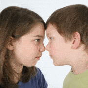boy and girl pressing foreheads together