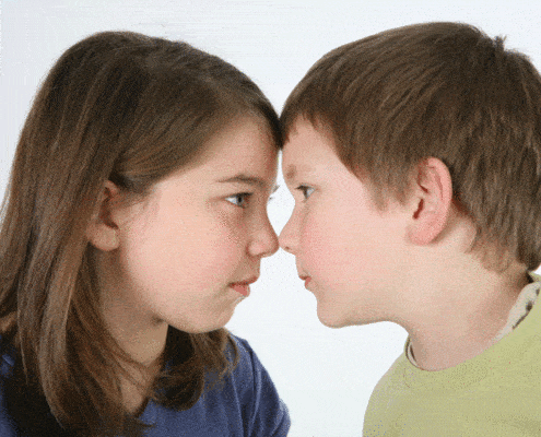 boy and girl pressing foreheads together
