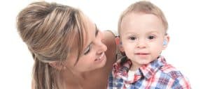 Mom and toddler with hearing aids