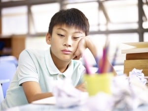 Bored looking child in classroom